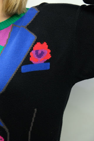 Schwarzer 80s Baumwollpullover mit verrücktem Strickmuster in bunten Farben – ein seltenes Fundstück