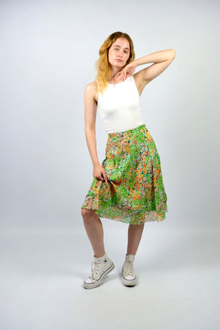 Handmade 70s Rock in tollem A-Linie-Schnitt mit zweilagigem Design und floralem Muster in Hellgrün, Orange, Gelb, Türkis, Pink/Beere, Weiß und Schwarz – ideal für die Zwischengröße M/L und ein absolutes Highlight