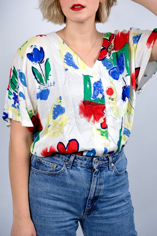 Weiße 90s Bluse aus reiner Viskose mit Crazy Pattern Print in Blau, Rot, Grün und Gelb – wir empfehlen die Bluse einer heutigen L bis 3XL (40 bis 46) je nach gewünschter Passform (bitte Maße beachten)